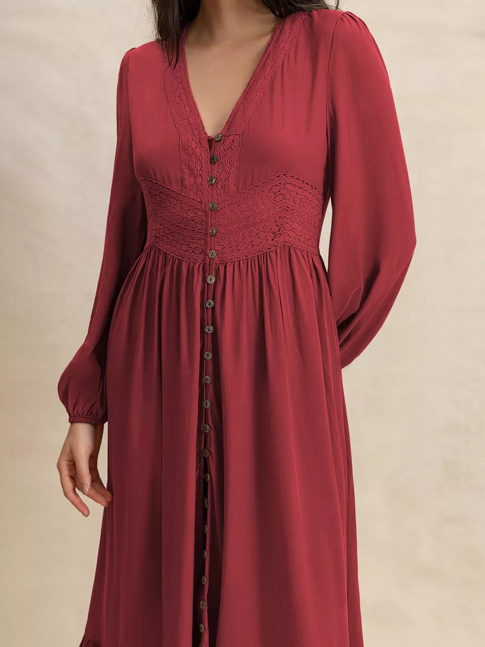 Burgundy maxi dress with balloon sleeves, lace trim, and button front