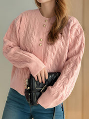 Dusty Pink cable knit cardigan with puff sleeves and gold buttons.