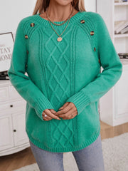 Green cable knit raglan sweater with button shoulder detail and crew neck.