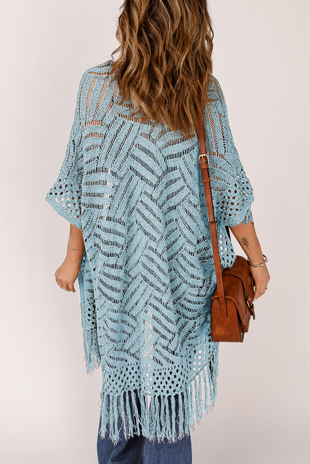 Light blue open knit chevron fringe cardigan with short sleeves and a boho vibe.