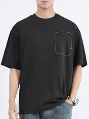 Black cotton crew neck t-shirt with decorative pocket detail and half sleeves.