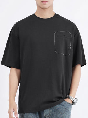 Black cotton crew neck t-shirt with decorative pocket detail and half sleeves.