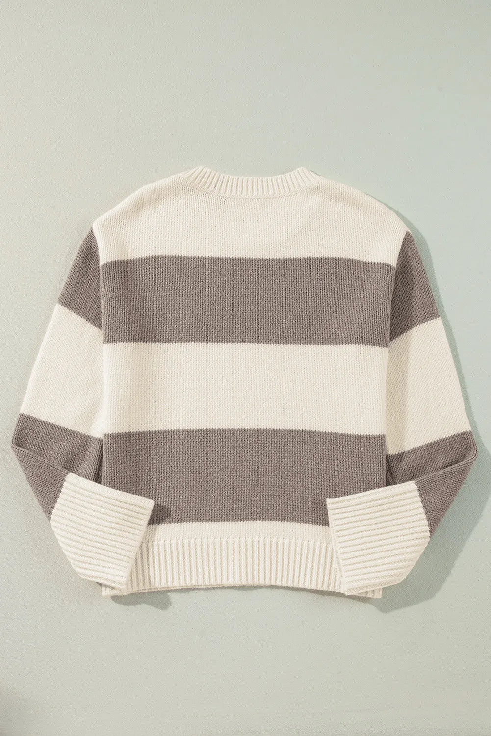 Relaxed knit sweater with bold horizontal stripes in cream and mocha.