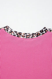 Pink ribbed crew neck top with leopard print trim