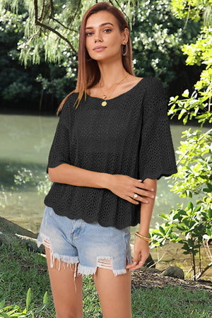 Black open-knit top with scalloped sleeves and hem, boat neck, short sleeves