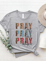 Gray graphic t-shirt with "PRAY" text in leopard print and solid colors, and "on it, over it, through it" text.