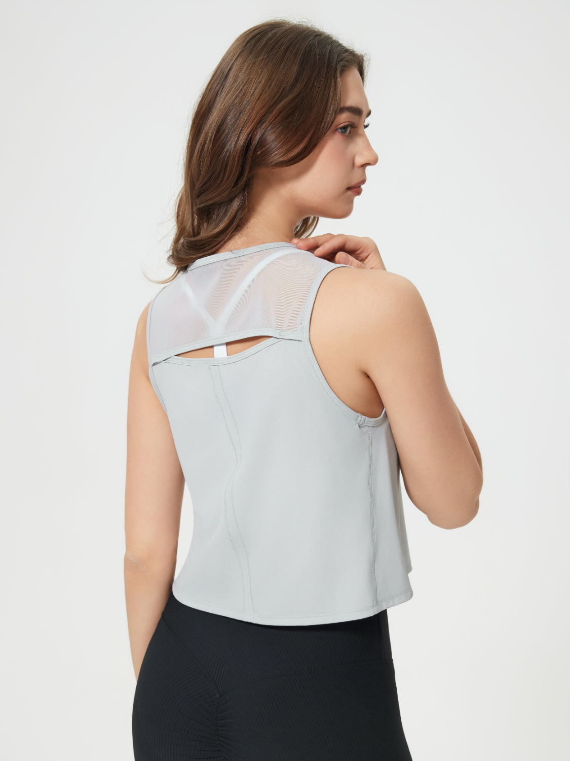 Light Gray cropped active tank with mesh back detail and cutout