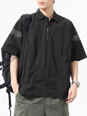 Black quarter-zip polo shirt with short sleeves, contrasting arm bands, and a chest pocket.