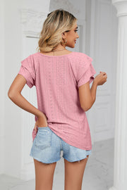 Blush pink eyelet knit blouse with flutter sleeves and V-neck, shown from the back.