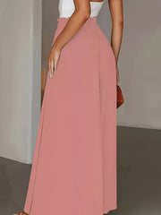 Pale blush wide-leg pants with paperbag waist and a flowing silhouette.