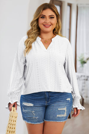 White textured slit-neck blouse with shirred cuffs and eyelet details.