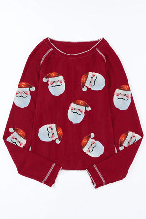 Scarlet waffle knit top with sequin Santa faces, crew neck, long sleeves.