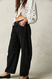 Black denim barrel leg jeans with button fly and pocket detail