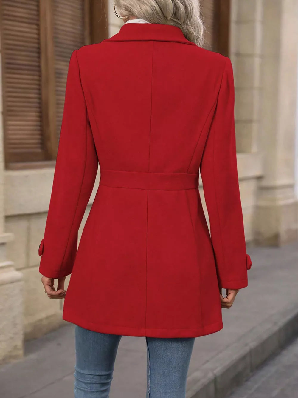 Scarlet button-up trench coat with cinched waist and buttoned cuffs.