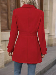 Scarlet button-up trench coat with cinched waist and buttoned cuffs.