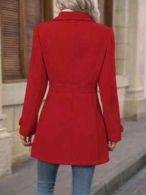 Scarlet button-up trench coat with cinched waist and buttoned cuffs.