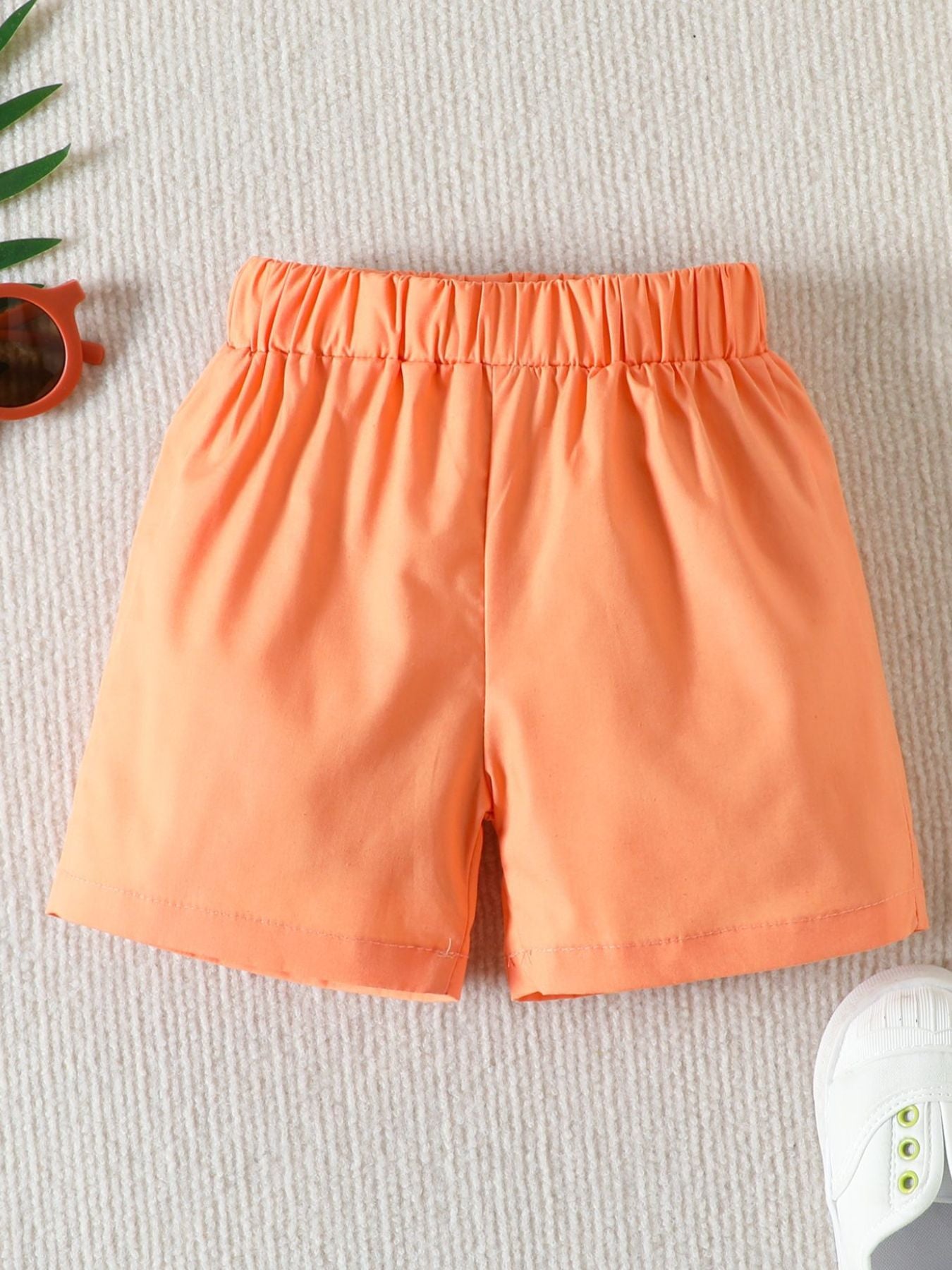 Orange toddler shorts with elastic waistband, cotton, casual style