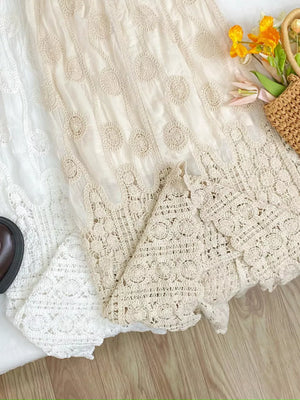 Luxe lace midi skirt in white and apricot with crochet details and elastic waist.