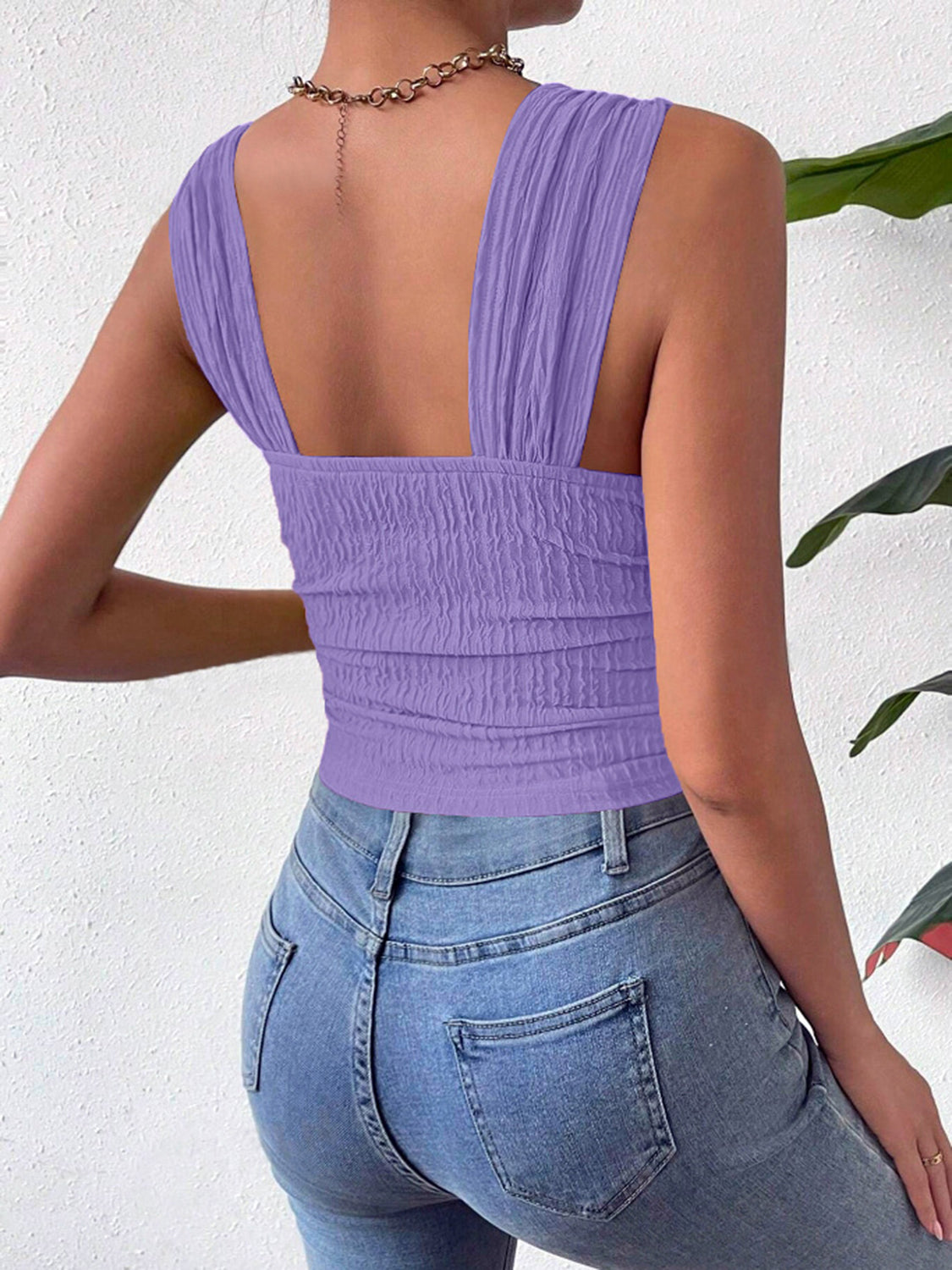 Lavender crinkle strap crop top with ruched texture and square neckline.