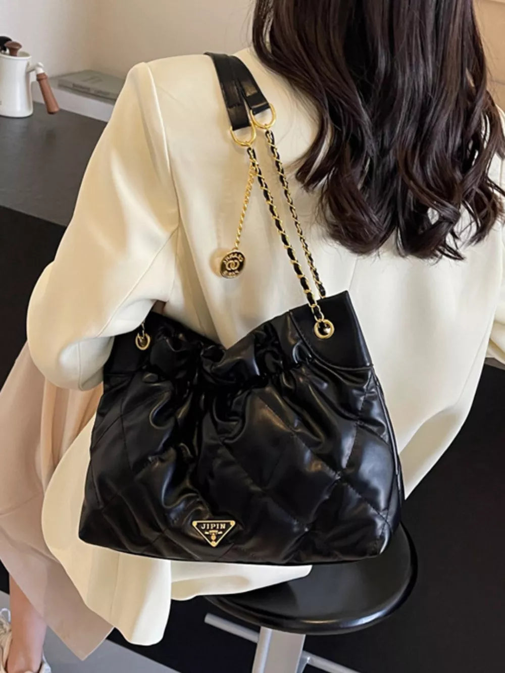 Ruched Leather Shoulder Bag in Black, model styling view