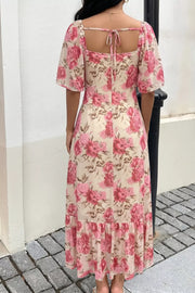 Charming floral midi dress with flutter sleeves and a tie-back square neck.