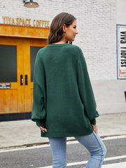 Green acrylic crewneck sweater with balloon sleeves and ribbed hem.