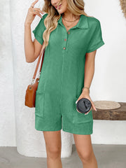 Green ribbed knit romper with patch pockets, collared neckline, and button accents.