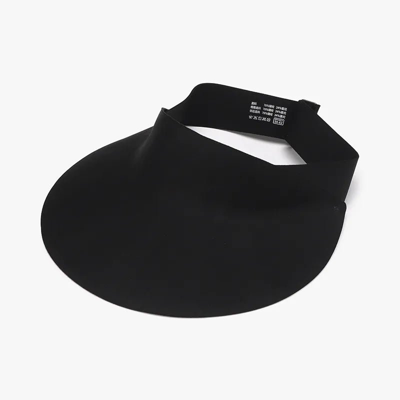 Black sculptural visor sun shield with adjustable band and care tag.