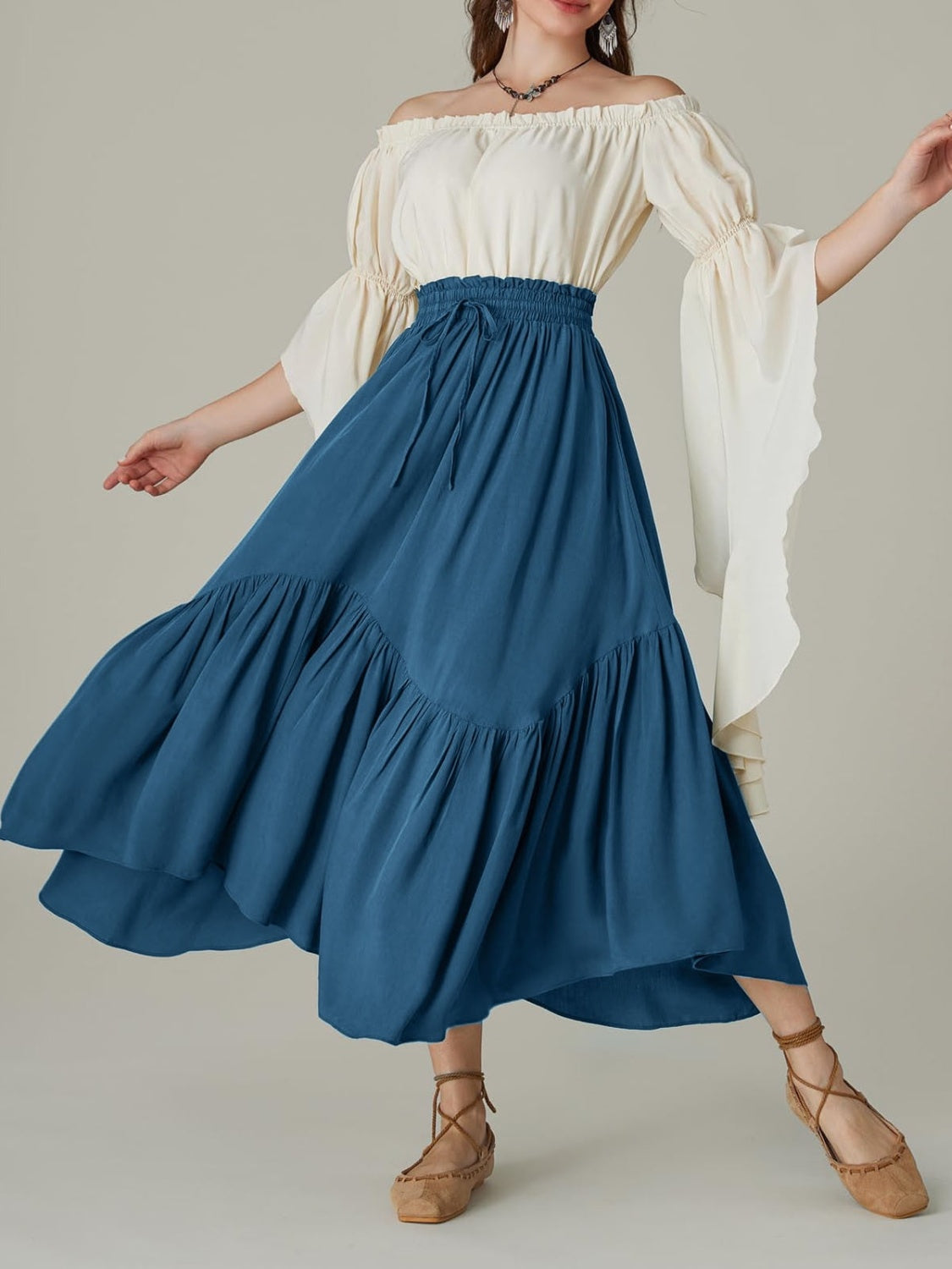 Tiered midi skirt in deep teal with asymmetrical hemline and drawstring waist.