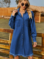 Dark wash denim shirt dress with frayed hem and button front, featuring chest pockets.