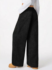 Black corduroy wide-leg maternity cargo pants with a relaxed fit.