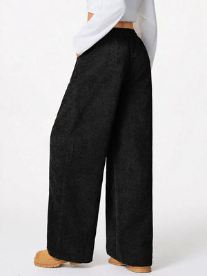 Black corduroy wide-leg maternity cargo pants with a relaxed fit.