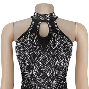 Black halter neck romper with rhinestone embellishments and keyhole cutout.