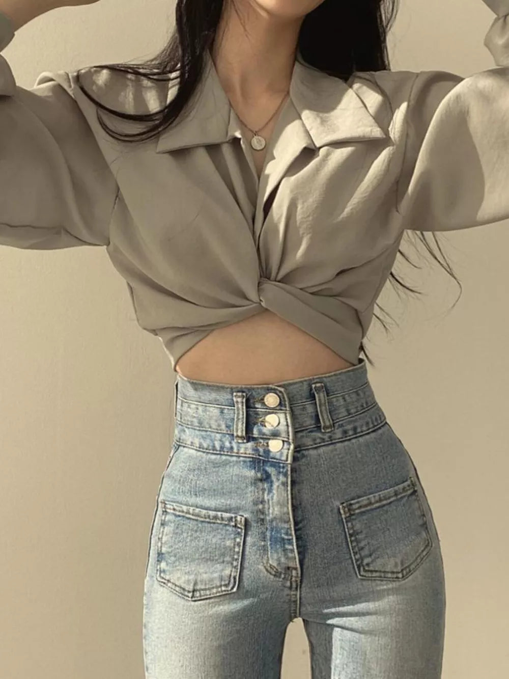 Grey polyester long sleeve shirt with twisted knot front detail and collar.