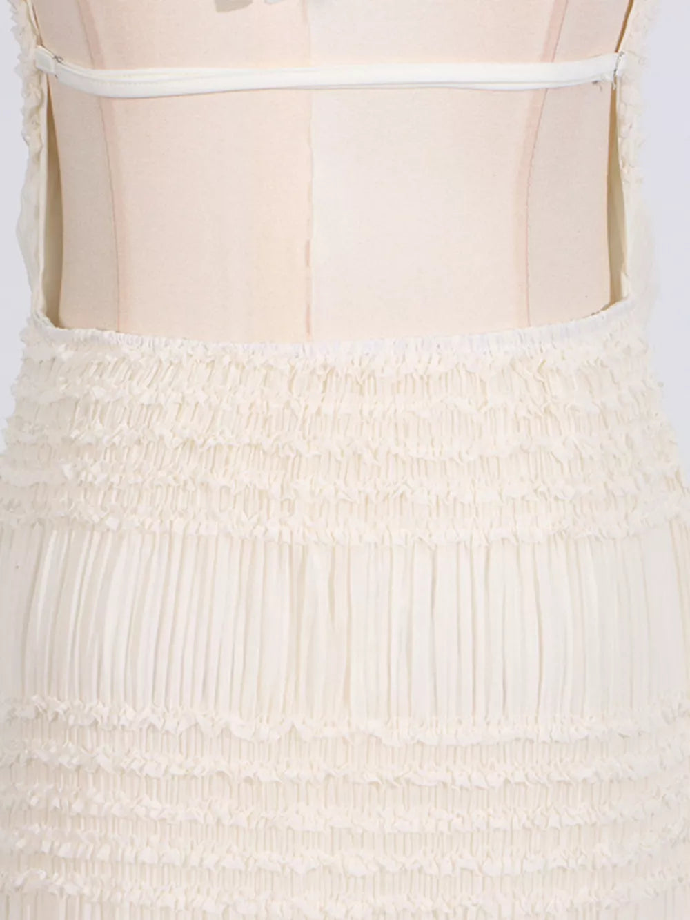 Cream textured halter neck maxi maternity swim dress with smocked waist and tiered skirt detail.