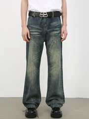 Vintage wash flare leg jeans in medium blue denim with whiskering and panel details.