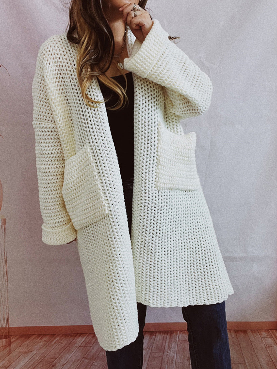 Chunky knit cocoon cardigan coat in white with pockets and cuffed sleeves.