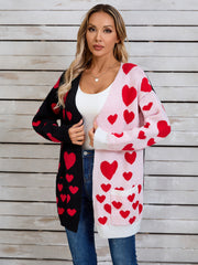 Heartbeat split-panel open cardigan in black and pink with red hearts, acrylic blend, pockets.