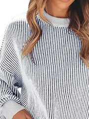 black pullover sweater featuring ribbed and striped