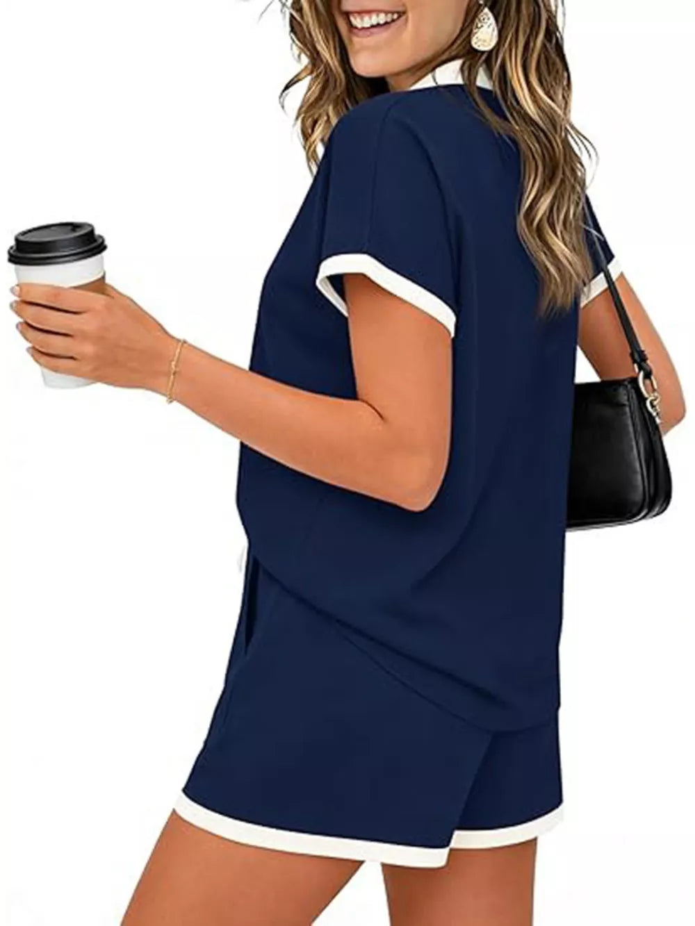 Navy blue two-piece set with white trim, polo collar, short sleeves, and drawstring shorts.