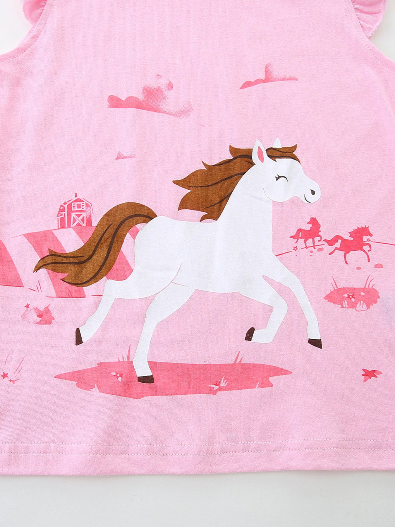 Pink cotton tank top with galloping horse graphic and ruffled sleeves.