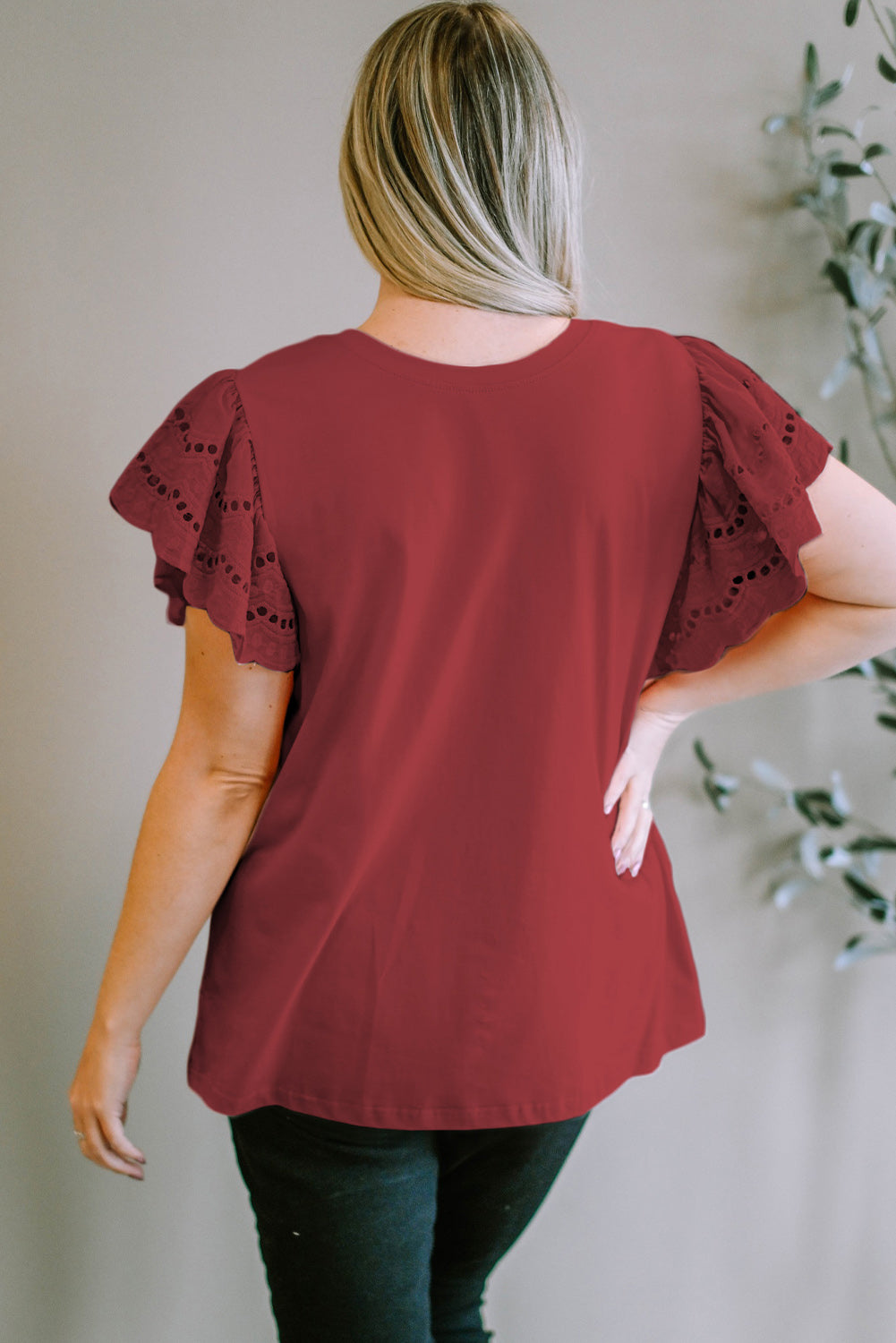 Burgundy eyelet flutter sleeve tee with a crew neck.