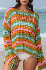 Striped crochet beach cover-up with a boat neck and long sleeves in multicolor stripes.