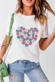 White t-shirt with a red, white, and blue floral heart graphic.
