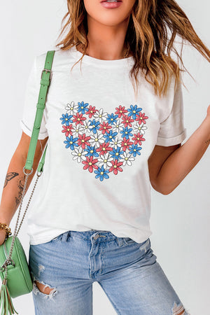 White t-shirt with a red, white, and blue floral heart graphic.
