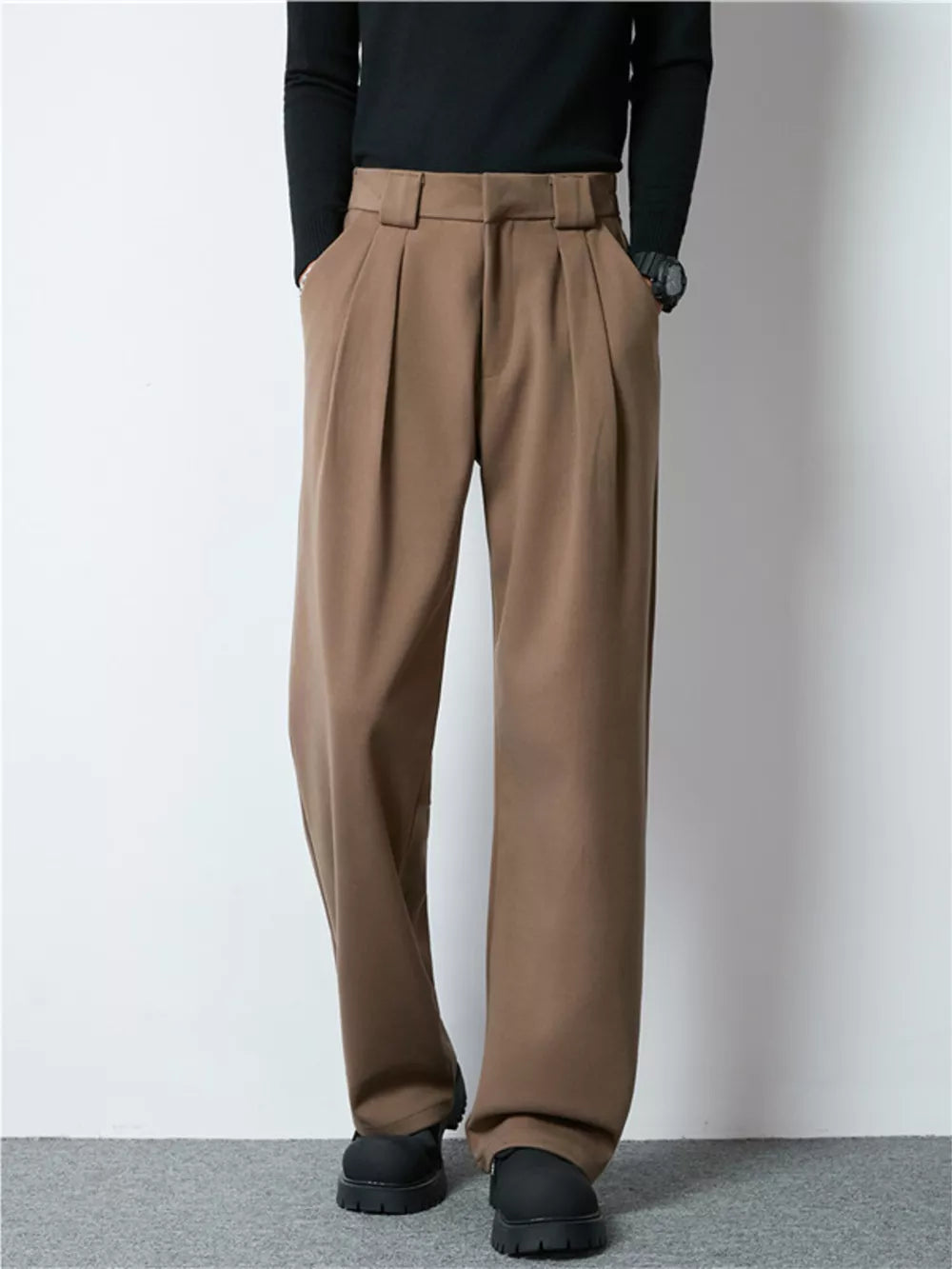 Men's dark brown wide-leg pleated dress pants with a relaxed fit.