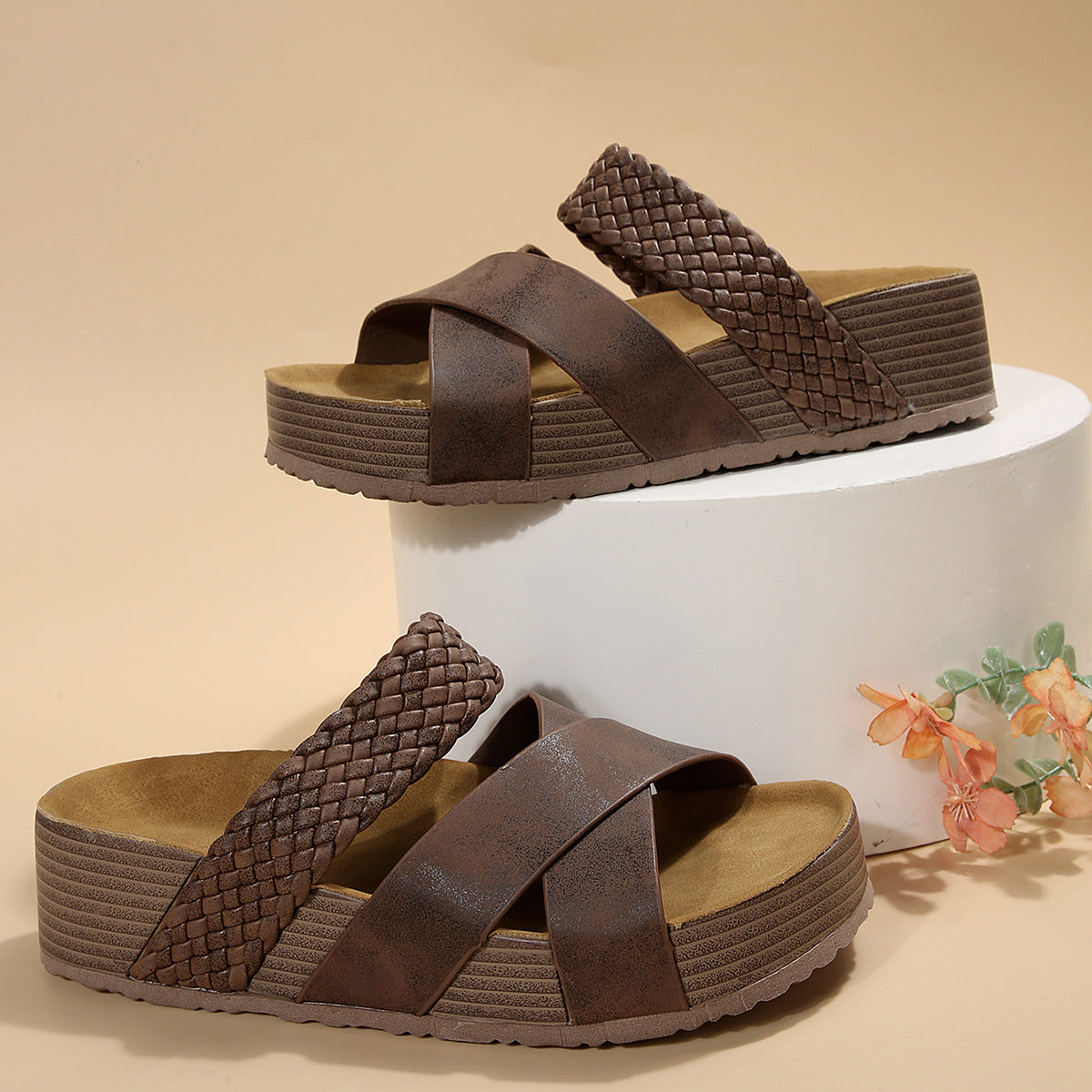 Braided strap platform sandals in coffee color with crisscross straps and textured sole.