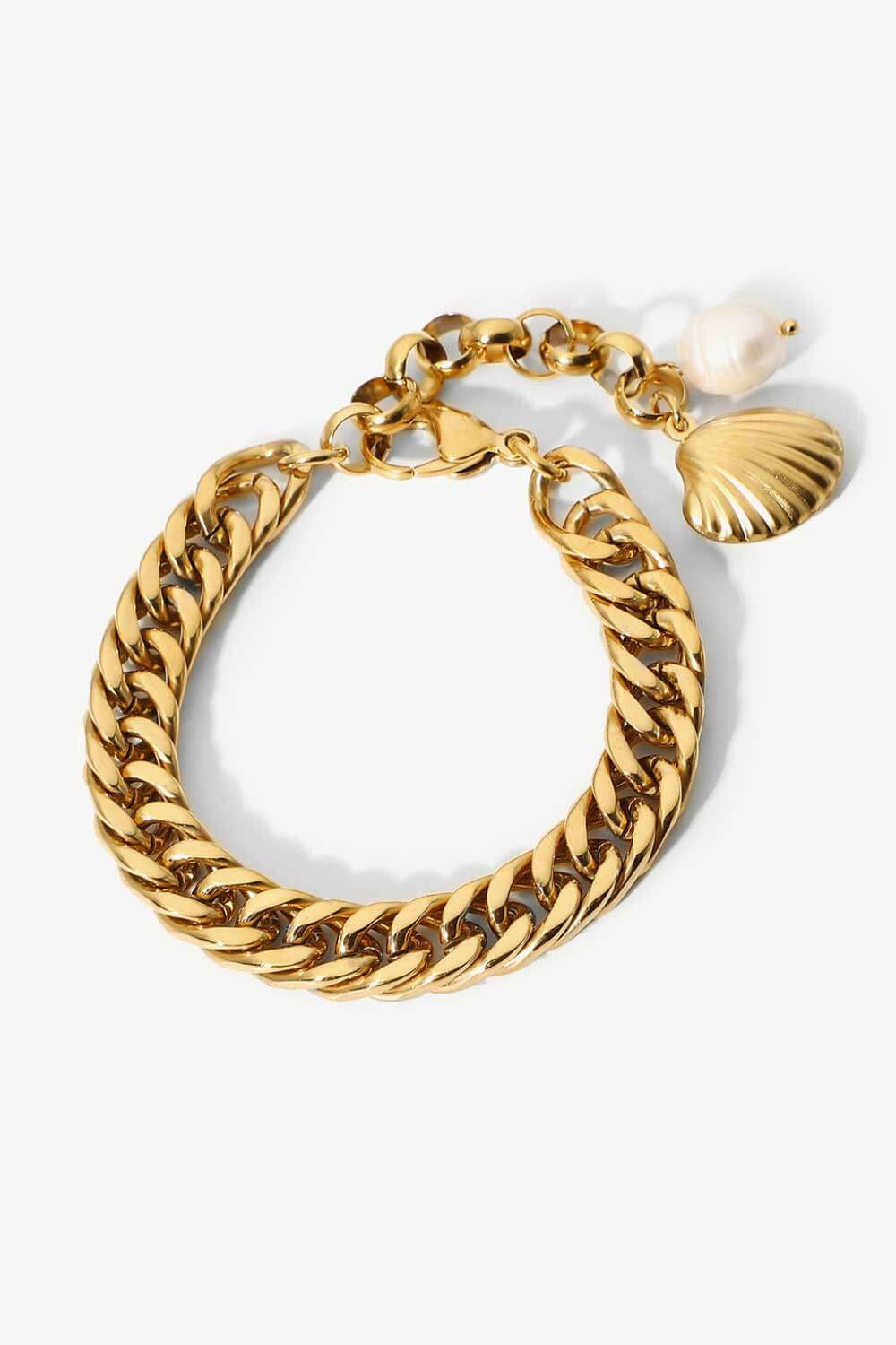 Gold chain bracelet with shell and pearl charms