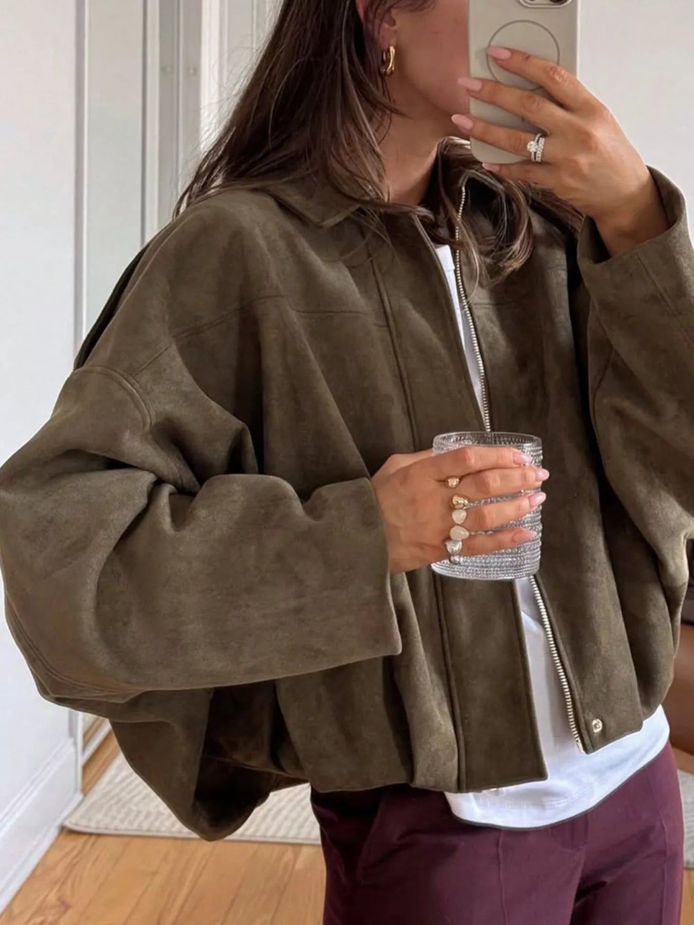 Oversized brown zip-up jacket with a collar and dropped shoulders.