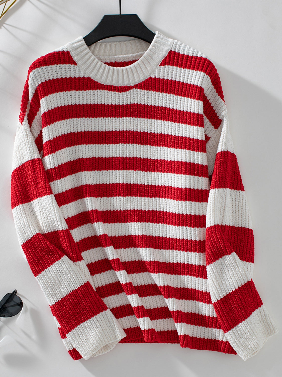 Bold stripe crewneck sweater in red and white knit with ribbed neckline and cuffs.